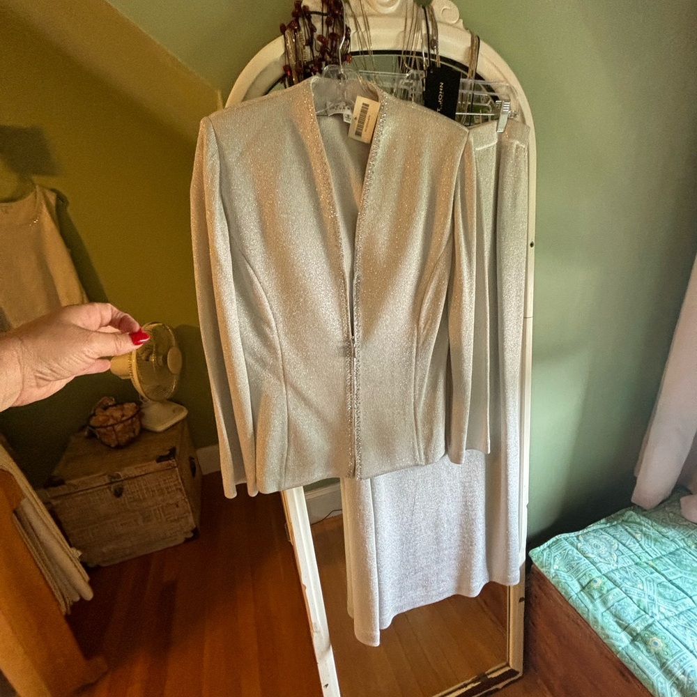 Enhance your wardrobe with this elegant St. John suit.